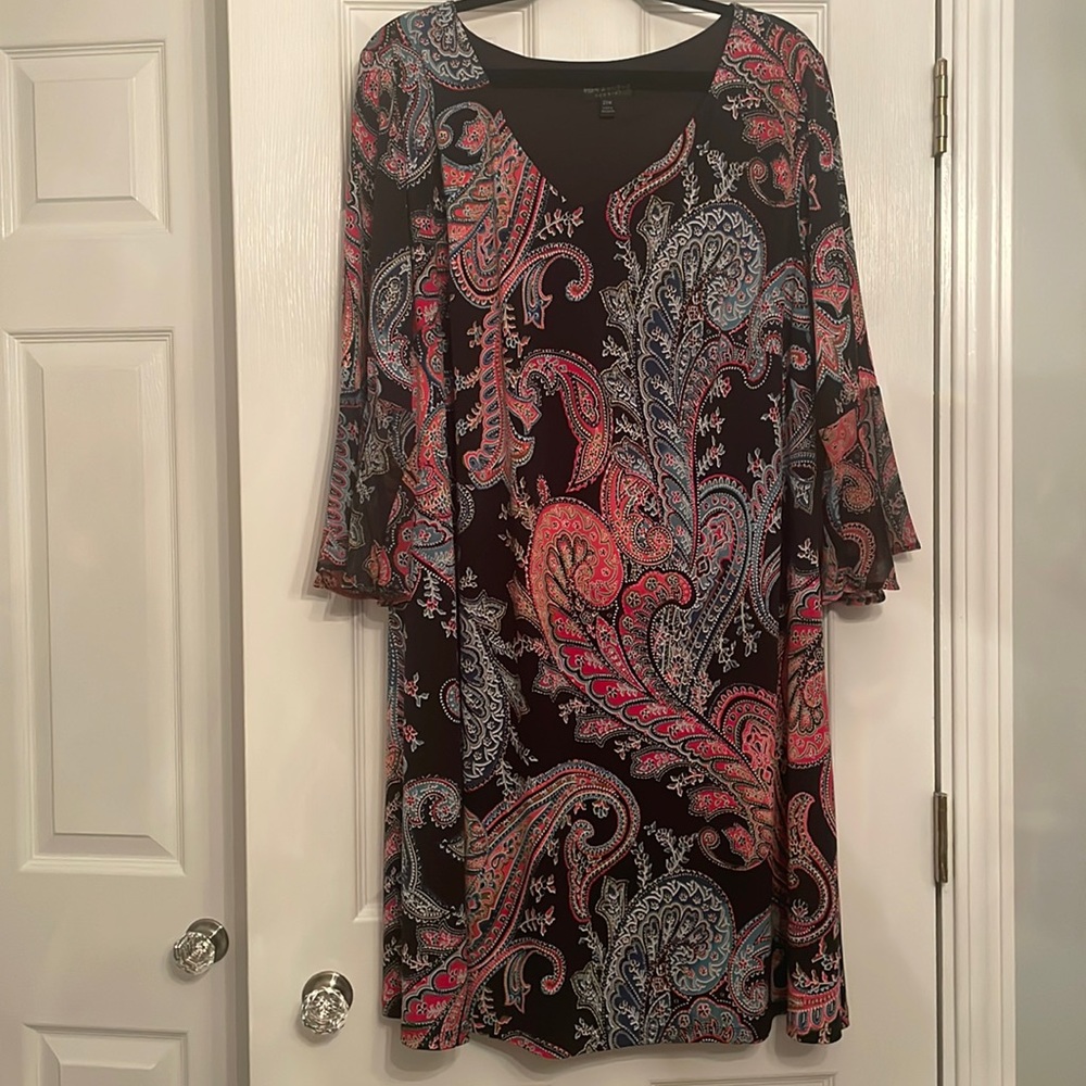 Connected apparel in a black muti color with bell sleeves